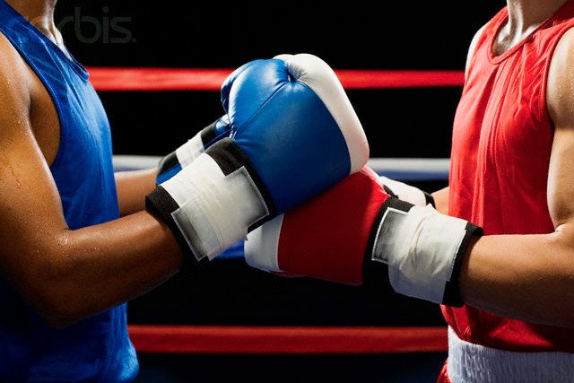 Boxers Touching Gloves Before Fight --- Image by © Nice One Productions/Corbis